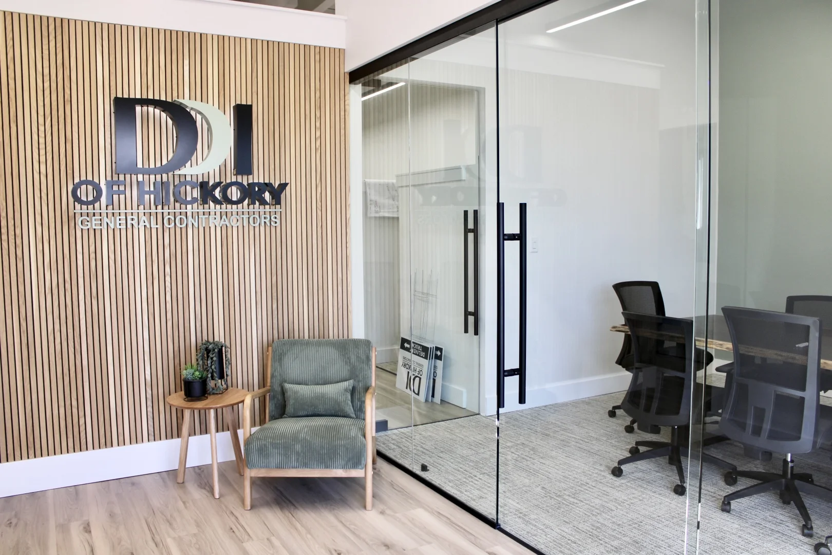 HIGH VIEW OF OFFICE ENTRANCE VIEW OF CONFERENCE ROOM AND SIGN