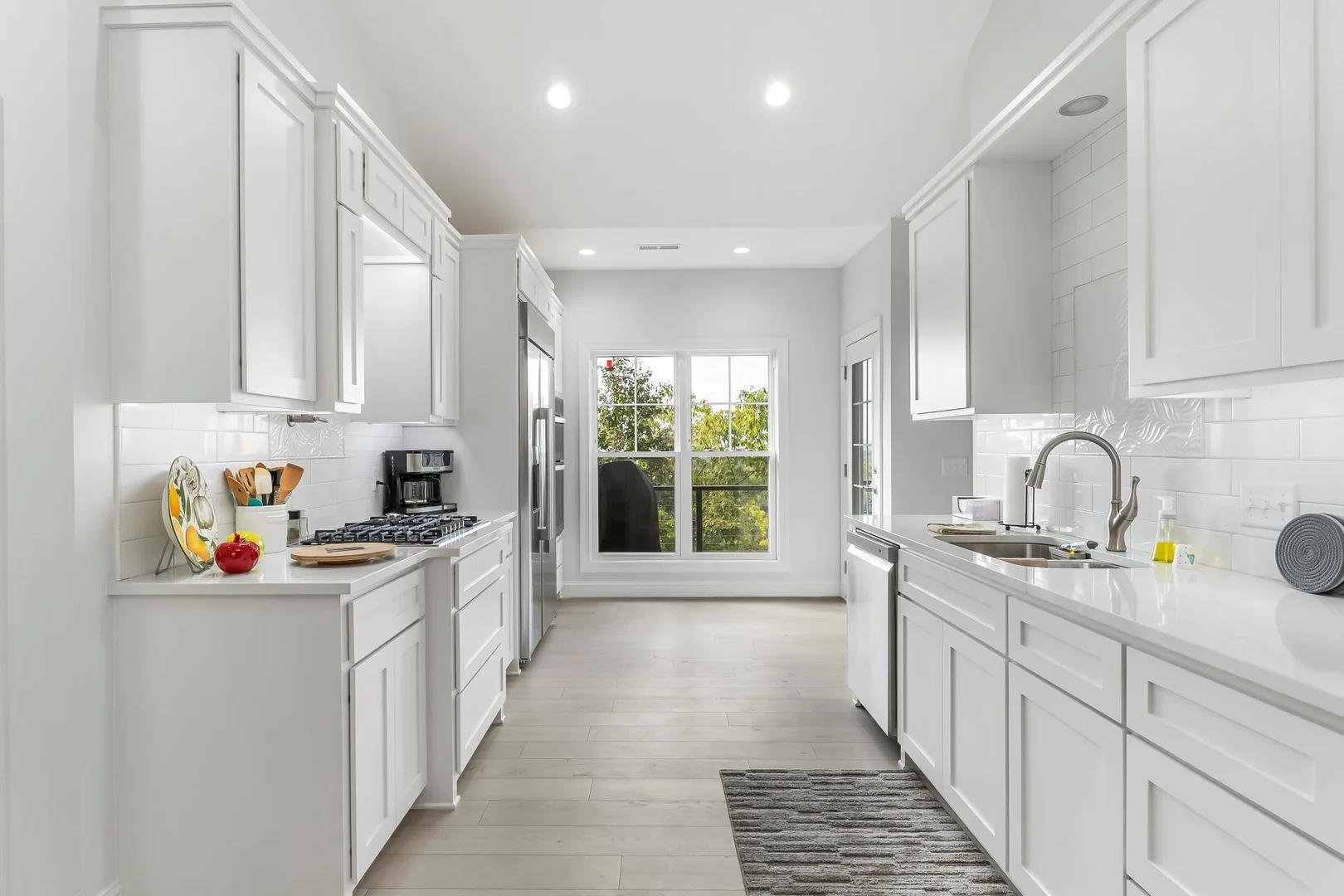 Kitchen Picture with Window in the back and red fruit