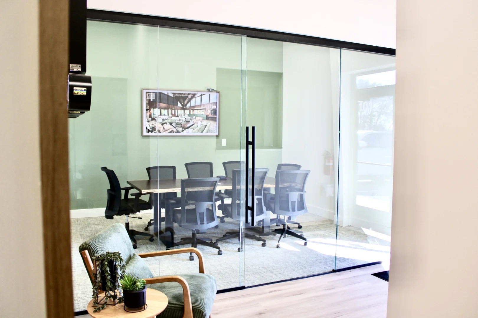 VIEW OF ENTRANCE AND CONFERENCE ROOM