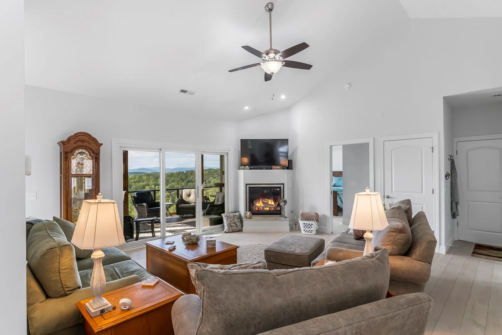 living room from behind the couch and fire place with window on left